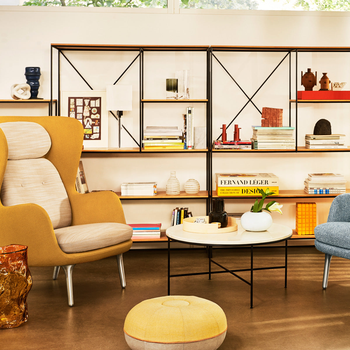 Ro Lounge Chair by Fritz Hansen, showing ro lounge chair in live shot.