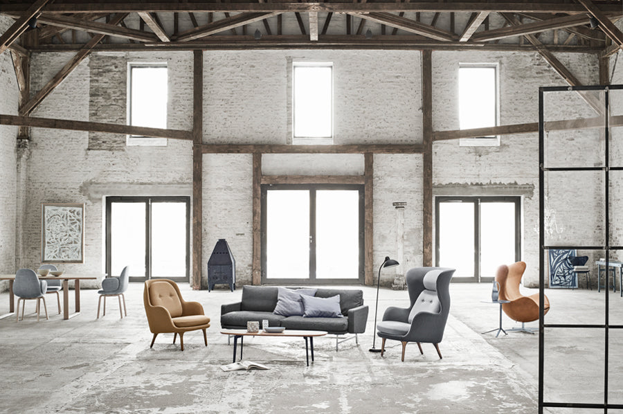 Ro Lounge Chair by Fritz Hansen, showing ro lounge chair in live shot.
