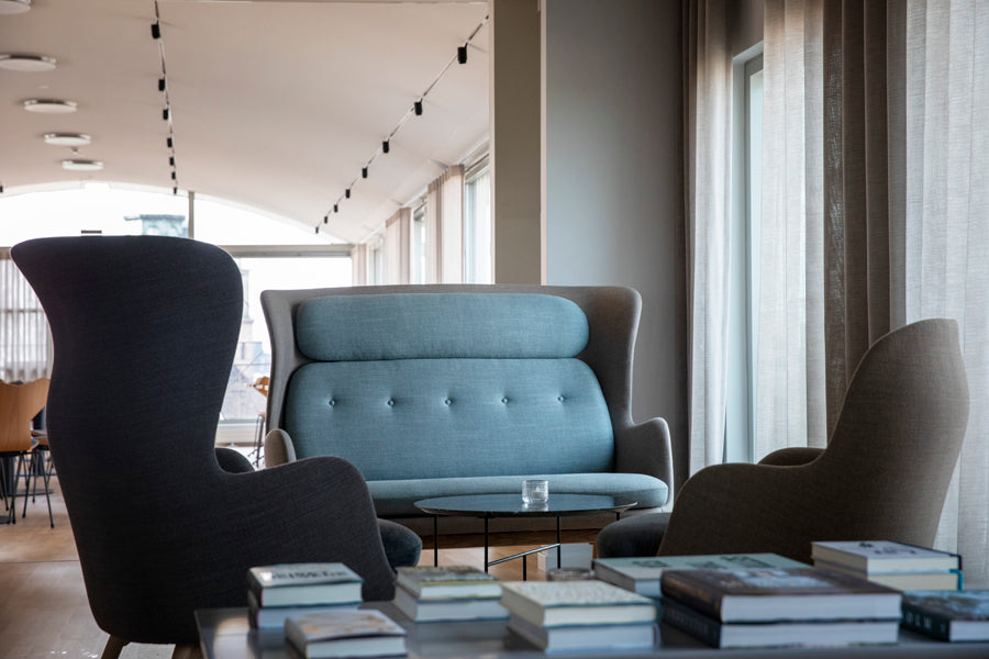Ro Sofa by Fritz Hansen, showing ro sofas in live shot.