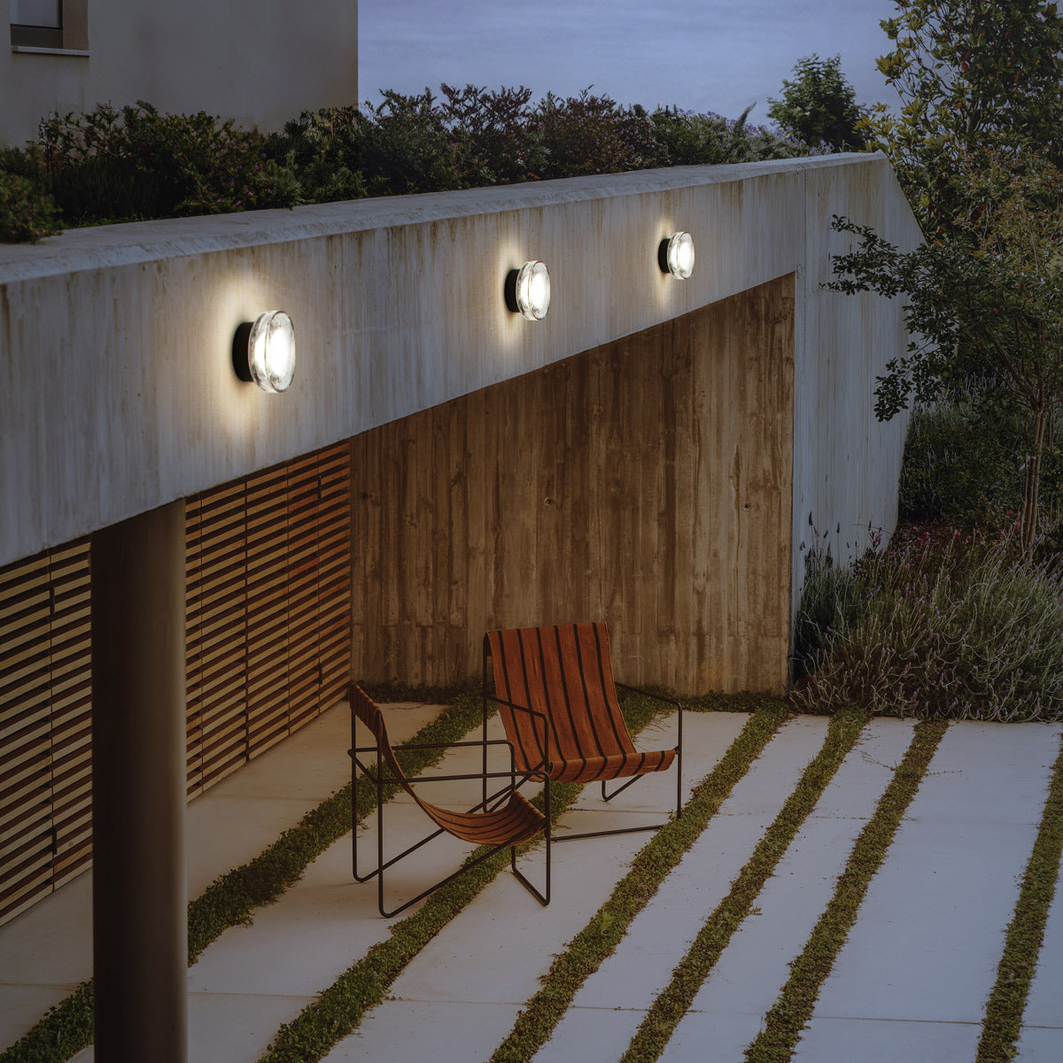 Roc Mini IP65 Wall/Ceiling Light by Marset, showing roc mini ip65 wall/ceiling lights in live shot.