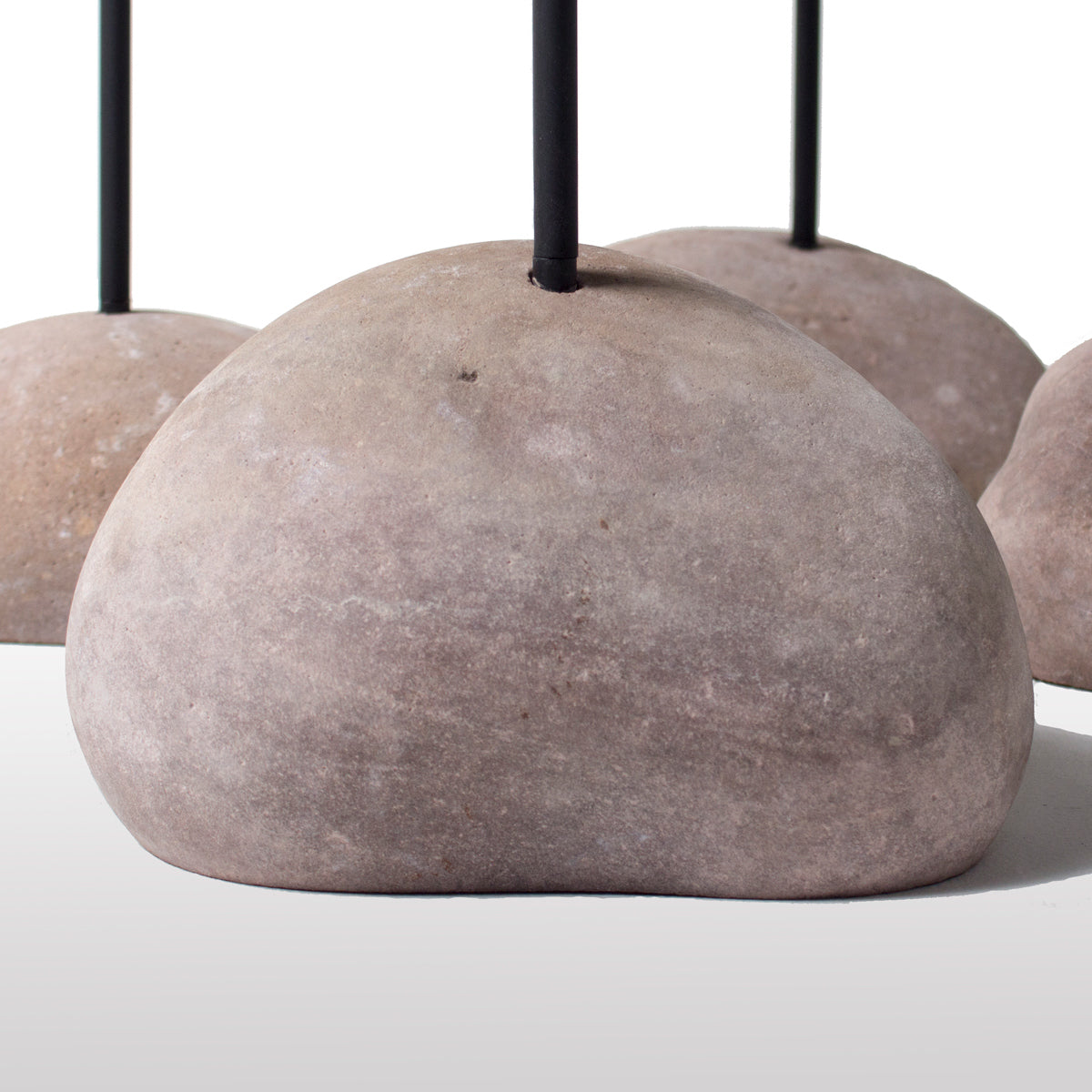 Rocky Tabloa Side Table by Tronk Design, showing closeup view of rocky tabloa side tables in live shot.