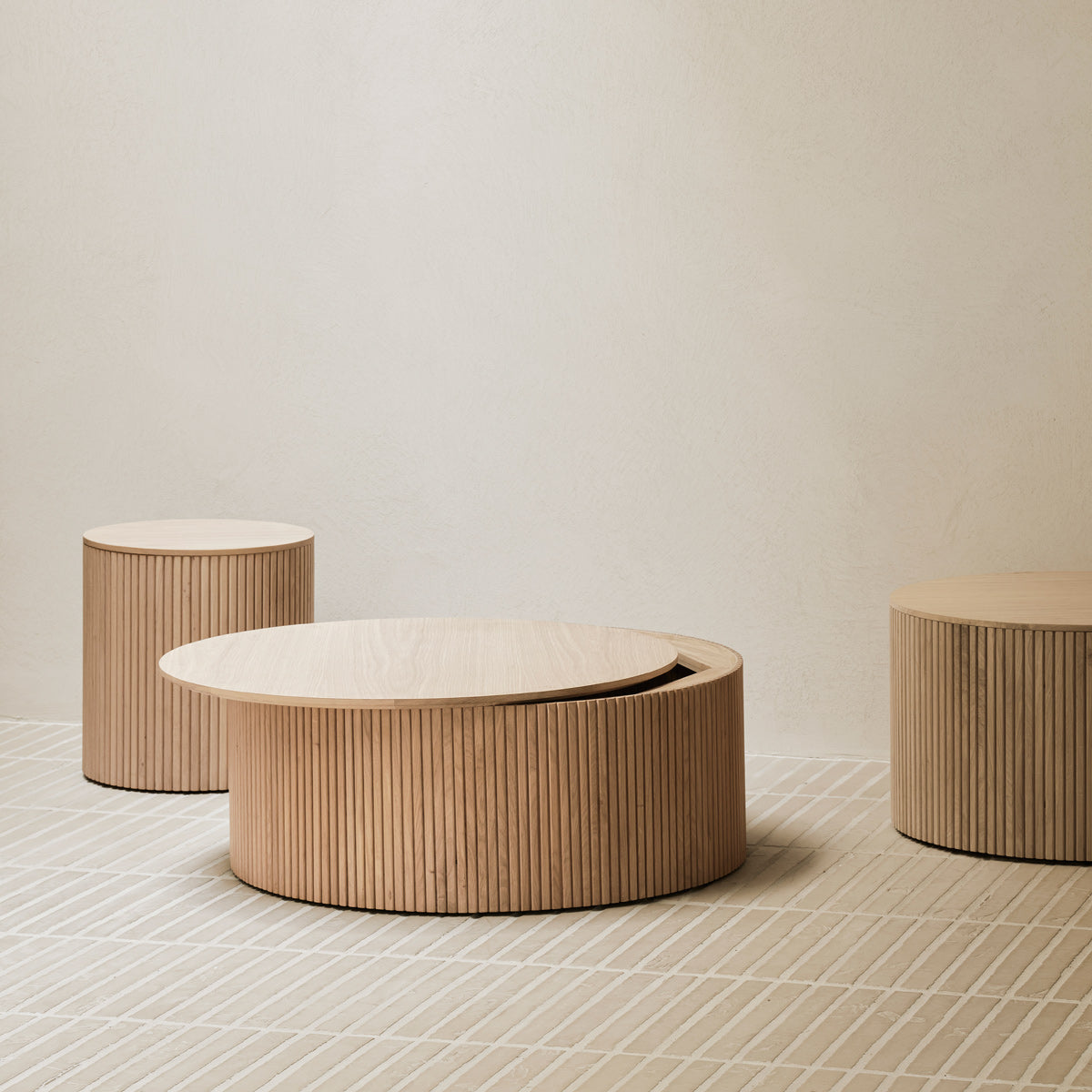 Roller Max Coffee Table by Ethnicraft, showing roller max coffee tables in live shot.