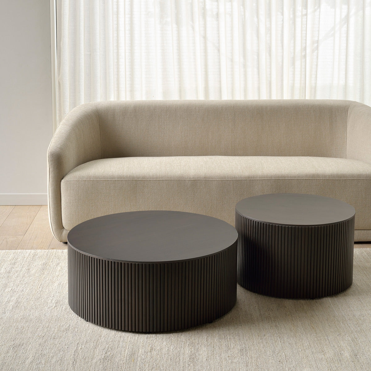 Roller Max Coffee Table by Ethnicraft, showing roller max coffee tables in studio shot.