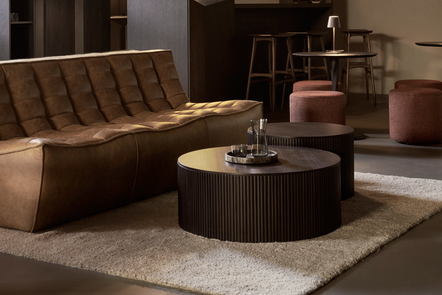 Roller Max Coffee Table by Ethnicraft, showing roller max coffee tables in live shot.