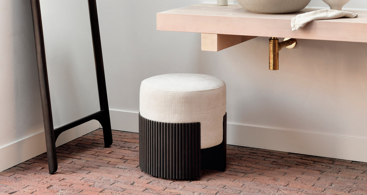 Roller Max Pouf by Ethnicraft, showing roller pouf in live shot.
