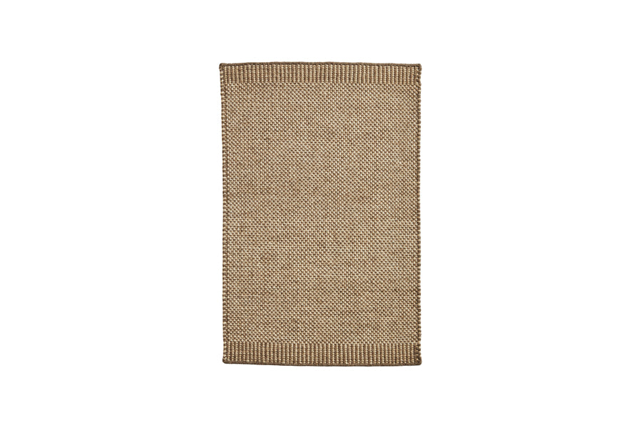 Rombo Mat by Woud, showing front view of rombo mat in large/brown woven wool.