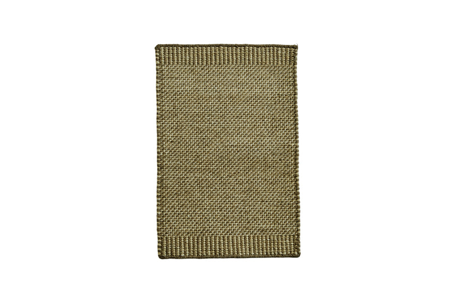 Rombo Mat by Woud, showing front view of rombo mat in small/moss green woven wool.