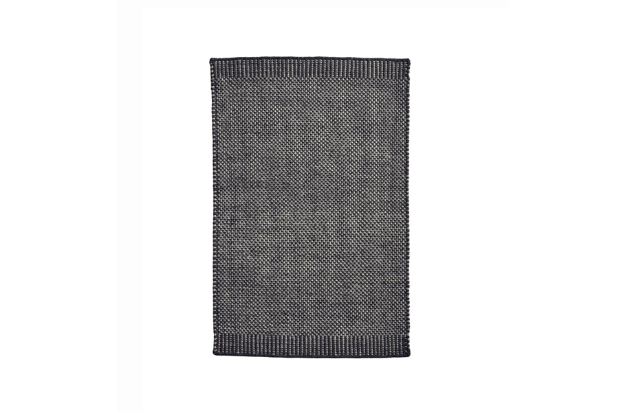 Rombo Mat by Woud, showing front view of rombo mat in large/grey woven wool.