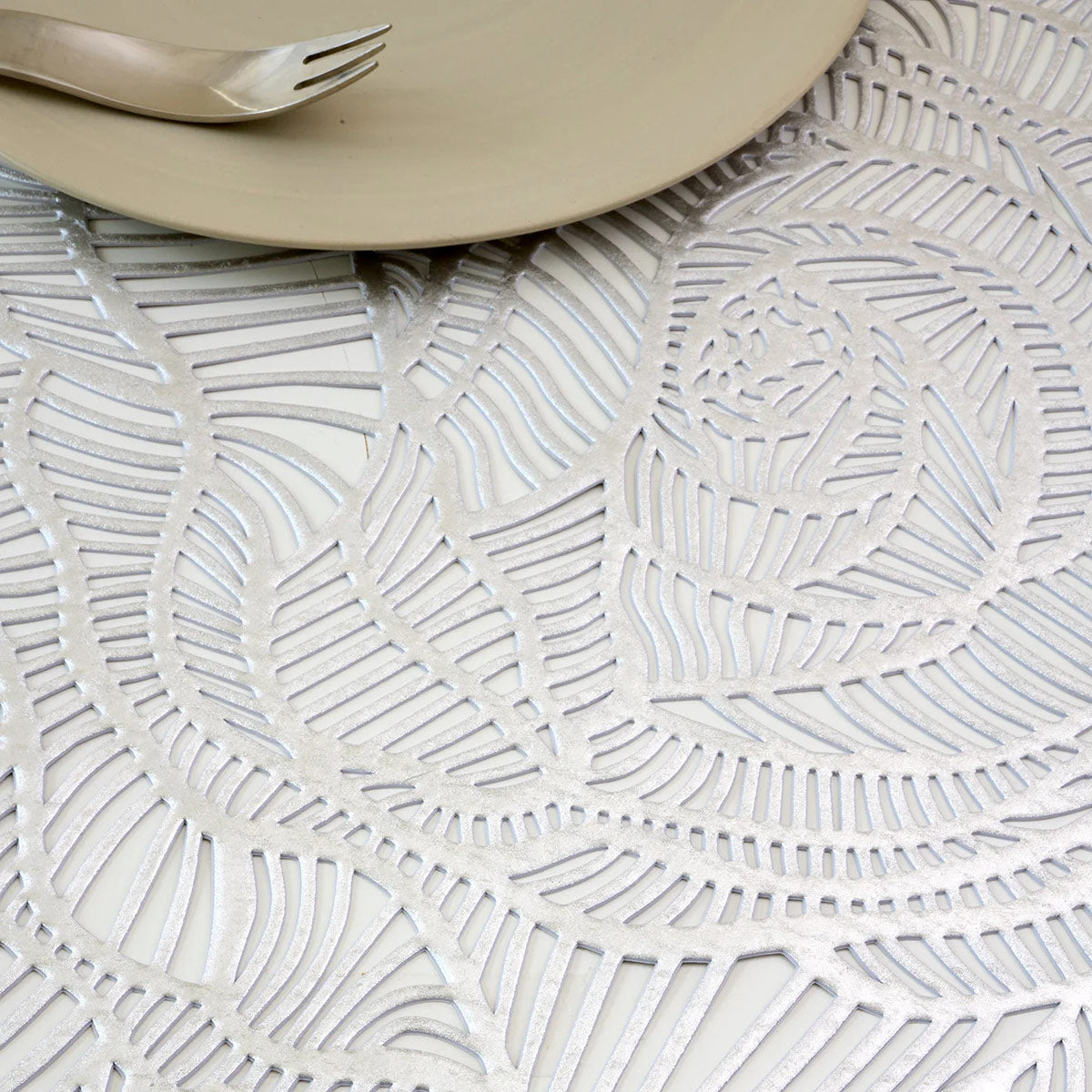 Rose Placemat by Chilewich, showing closeup view of rose placemat in live shot.