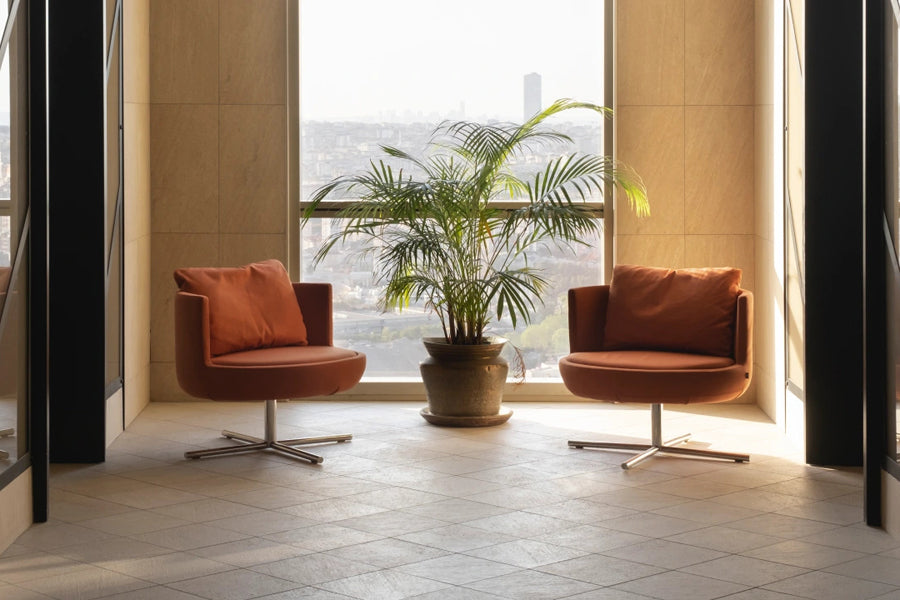 Round Swivel Metal Lounge Chair by B&T, showing round swivel metal lounge chairs in live shot.
