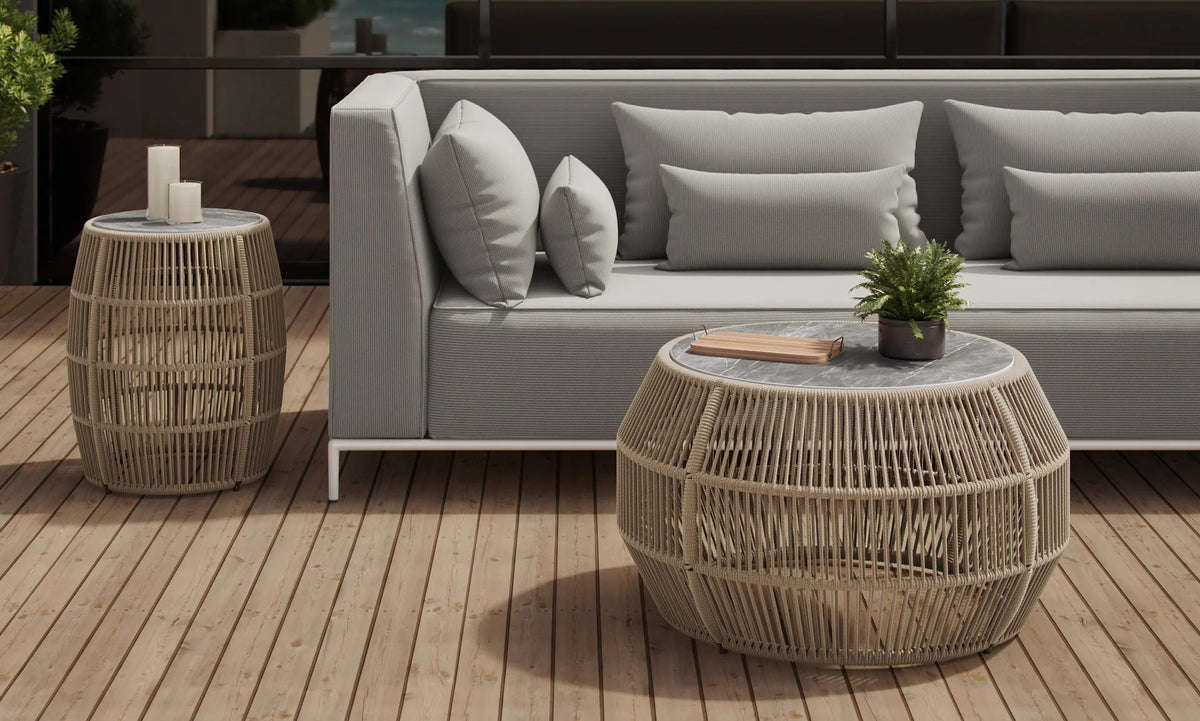 Rovel Outdoor Cocktail Table by Viesso, showing rovel outdoor cocktail table in live shot.