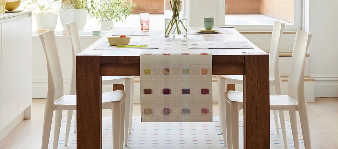 Sampler Tabletop by Chilewich, showing sampler tabletops in live shot.