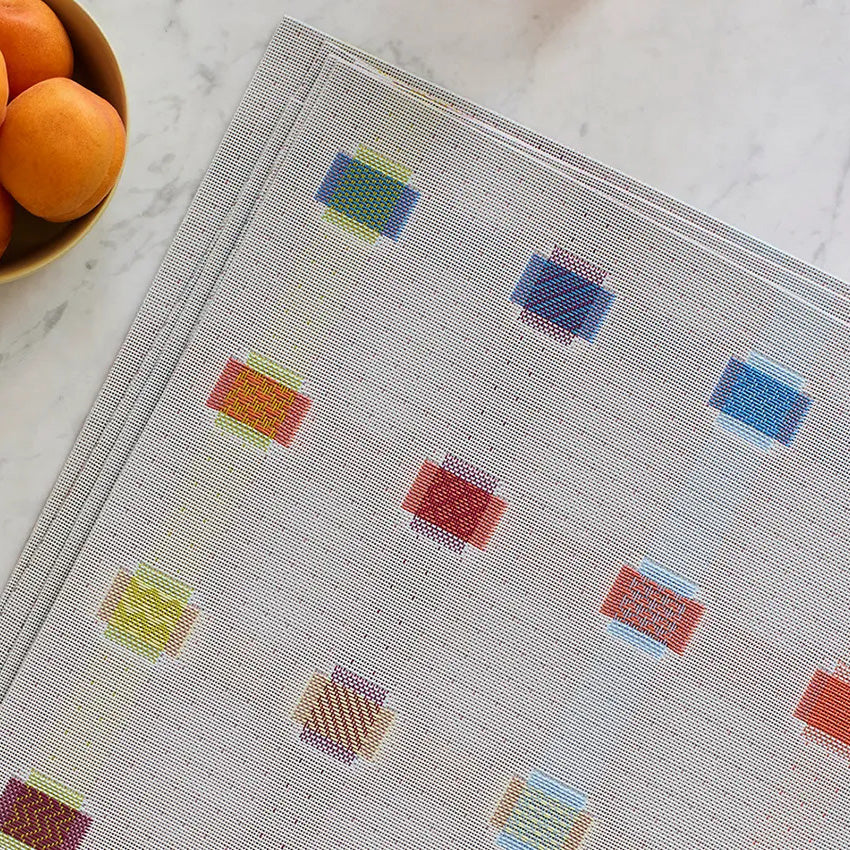 Sampler Tabletop by Chilewich, showing closeup view of sampler tabletop in live shot.