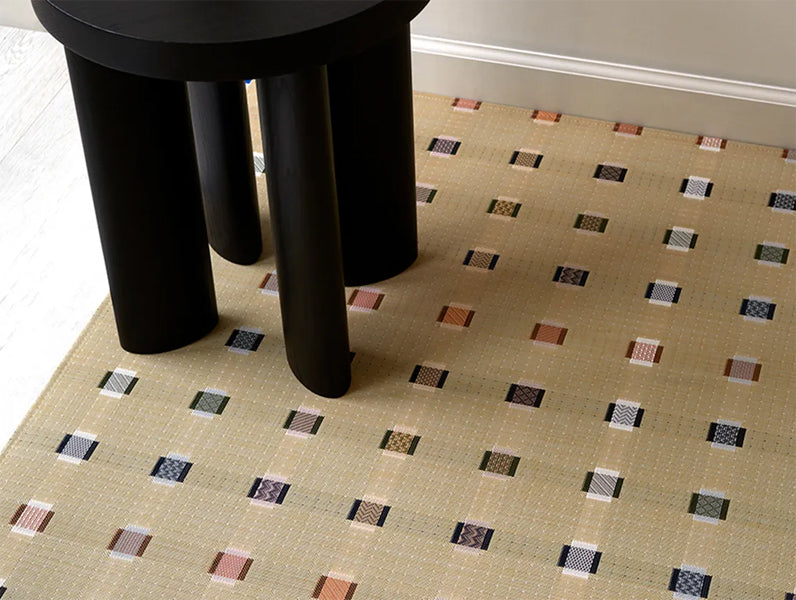 Sampler Woven Floor Mat by Chilewich, showing closeup view of sampler woven floor mat in live shot.