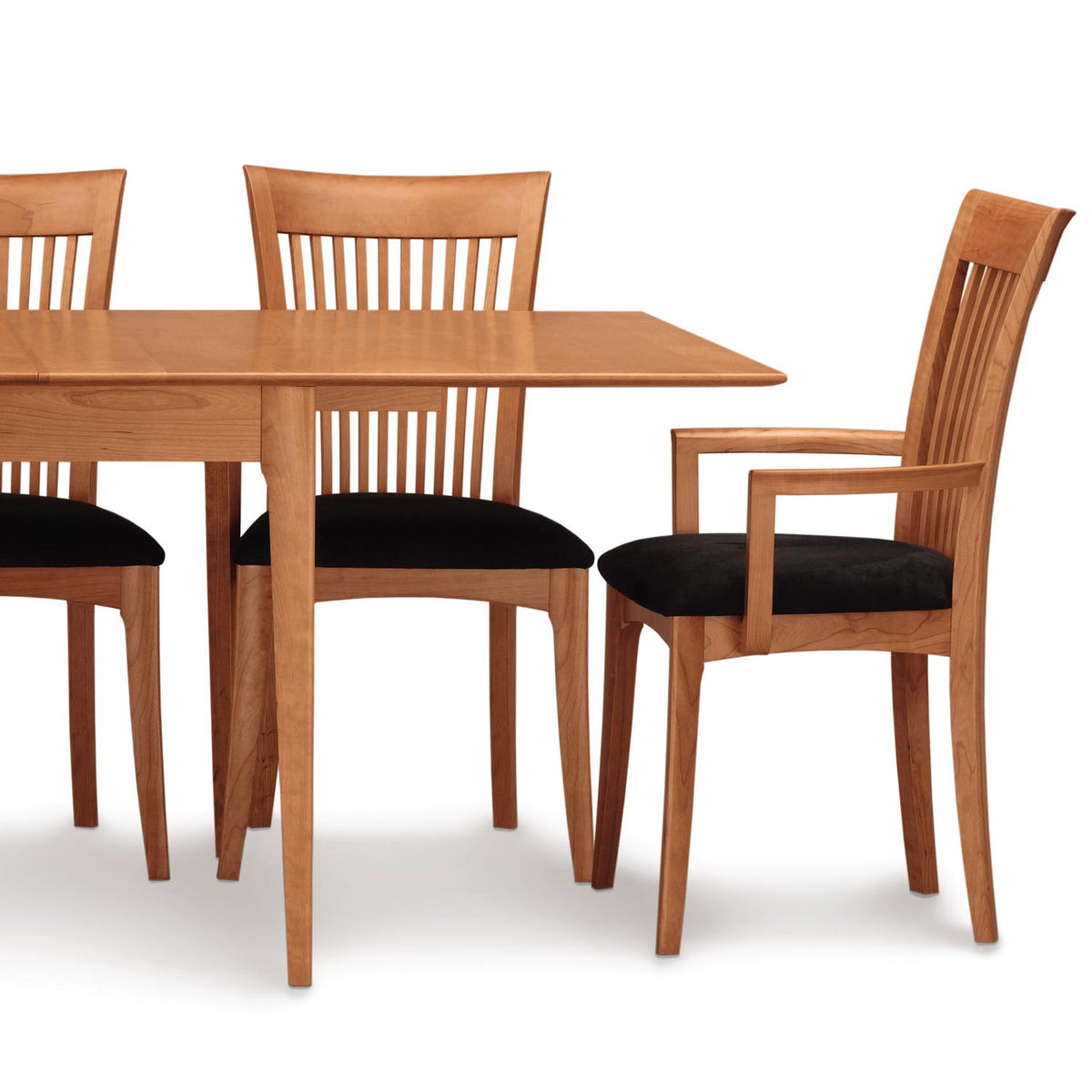 Sarah Upholstered ArmChair by Copeland Furniture, showing sarah upholstered armchair with table.
