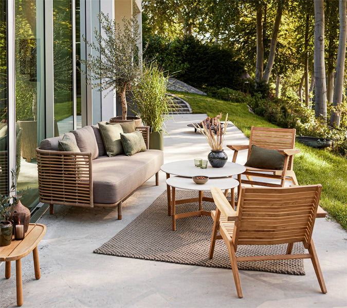 Sense Outdoor 3-Seater Sofa by Cane-Line, showing sense outdoor 3-seater sofa in live shot.