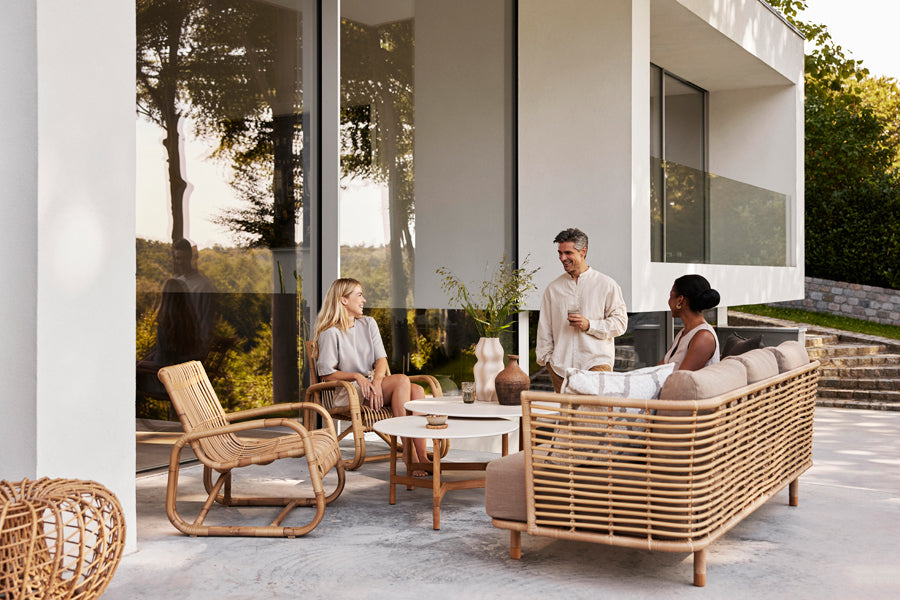 Sense Outdoor 3-Seater Sofa by Cane-Line, showing sense outdoor 3-seater sofa in live shot.