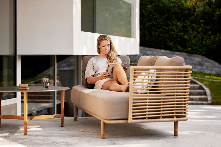 Sense Outdoor 3-Seater Sofa by Cane-Line, showing sense outdoor 3-seater sofa in live shot.