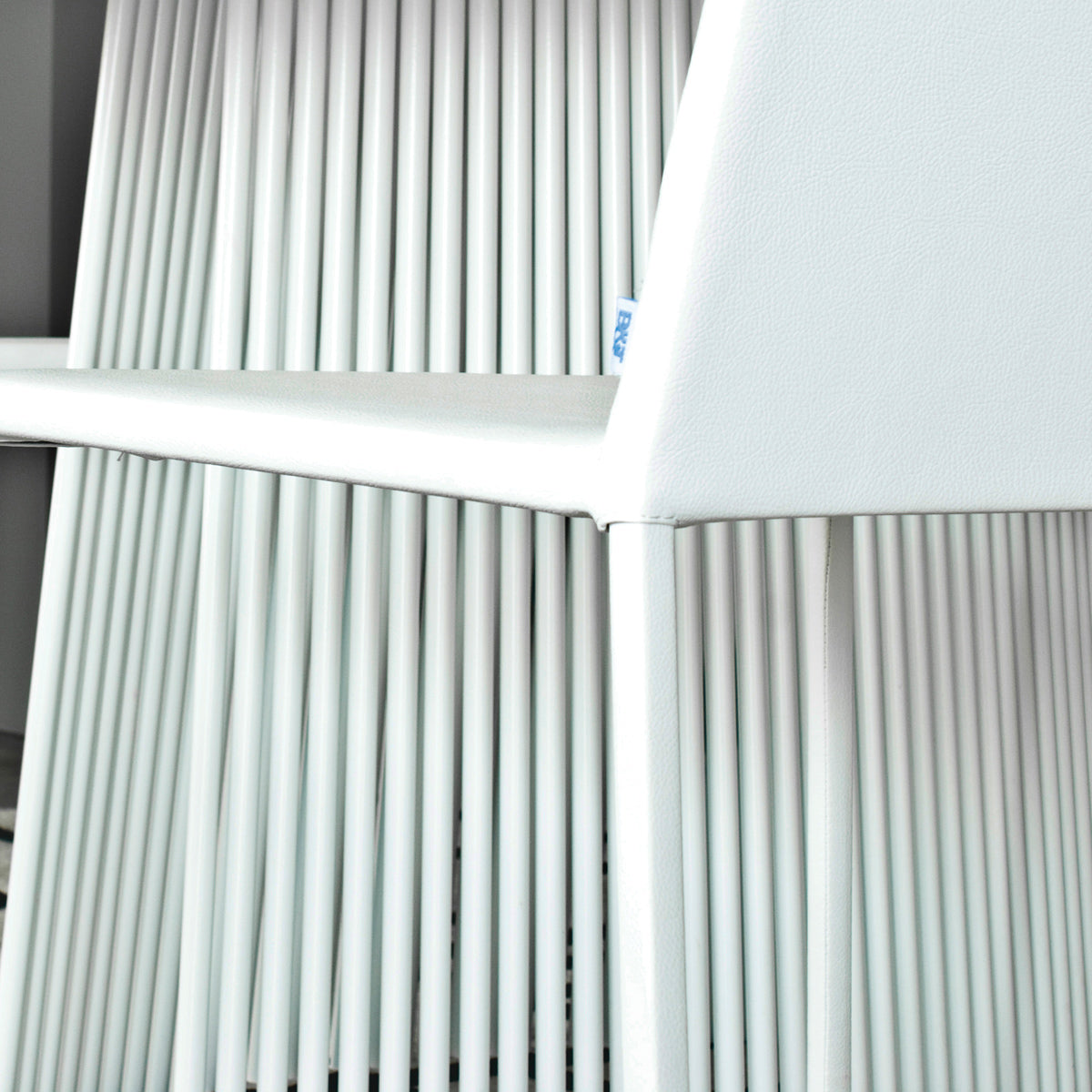 Seri Pedestal Table by B&T, showing closeup view of seri pedestal table in live shot.