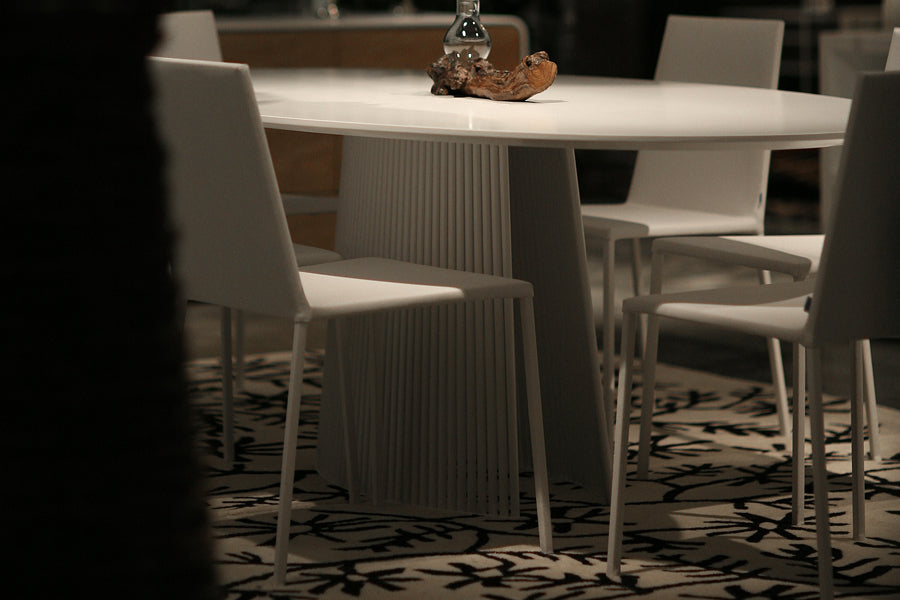 Seri Pedestal Table by B&T, showing closeup view of seri pedestal table in live shot.