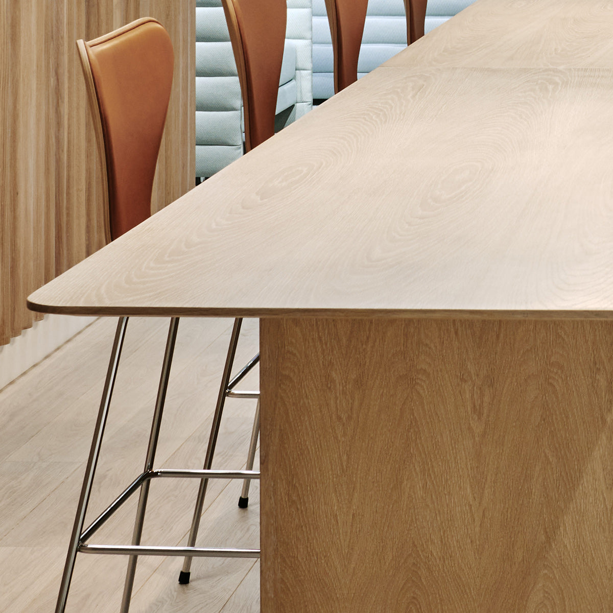 Series 7 Front Upholstery Stool by Fritz Hansen, showing closeup view of series 7 front upholstery stools in live shot.