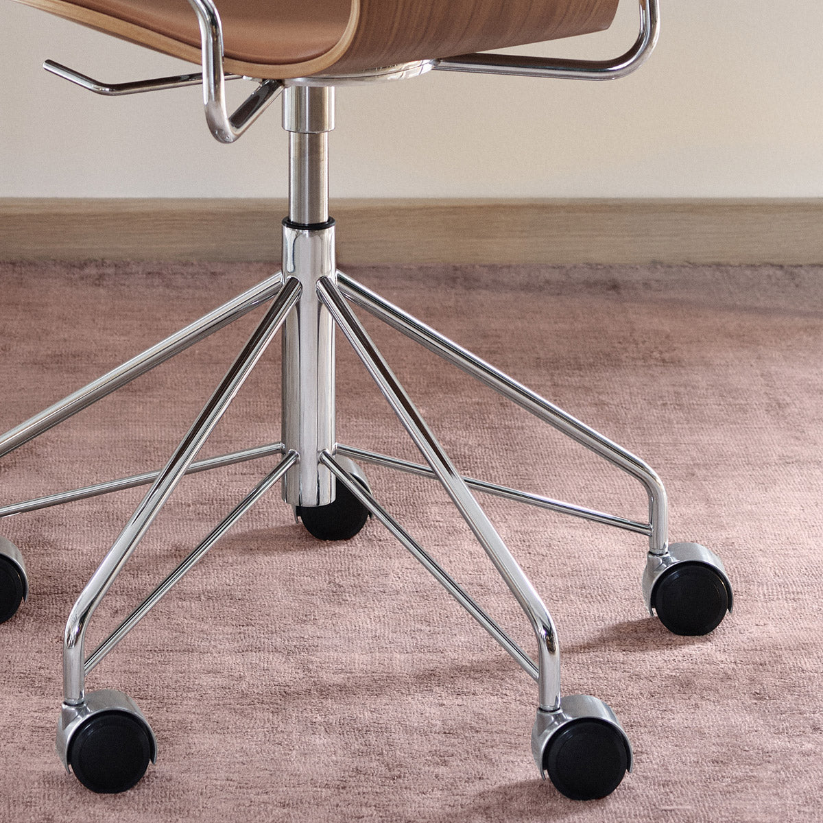 Series 7 Front Upholstery Swivel Armchair by Fritz Hansen, showing closeup view of series 7 front upholstery swivel armchair in live shot.