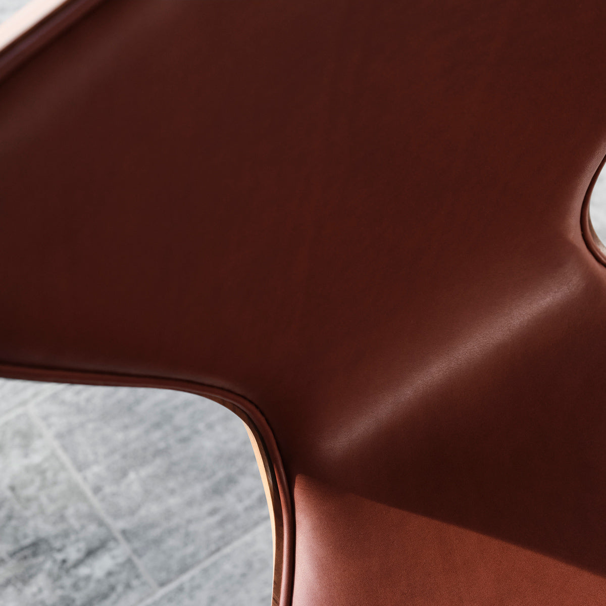 Series 7 Front Upholstery Swivel Chair by Fritz Hansen, showing closeup view of series 7 front upholstery swivel chair in live shot.