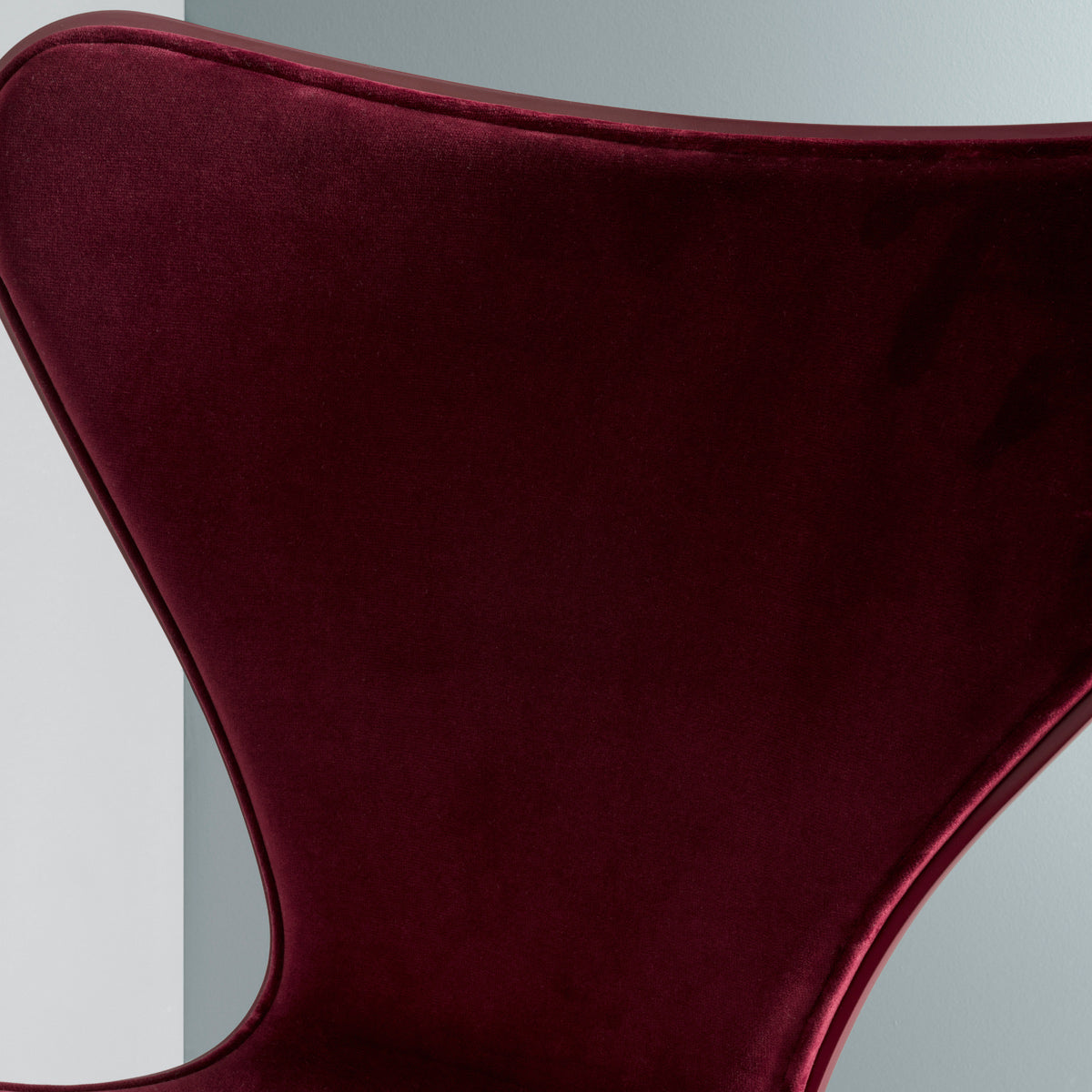 Series 7 Front Upholstery Swivel Chair by Fritz Hansen, showing closeup view of series 7 front upholstery swivel chair in live shot.