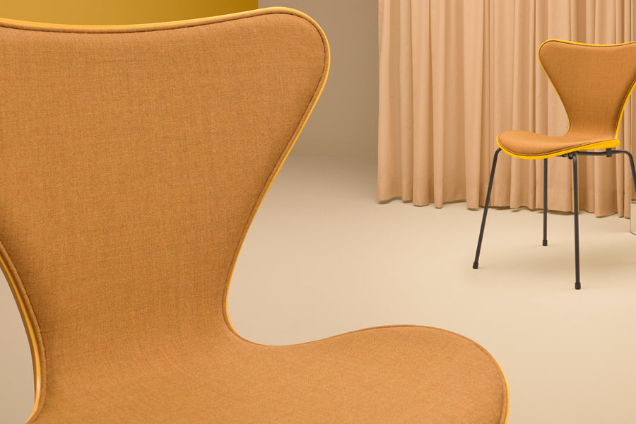 Series 7 Front Upholstery Swivel Chair by Fritz Hansen, showing closeup view of series 7 front upholstery swivel chair in live shot.