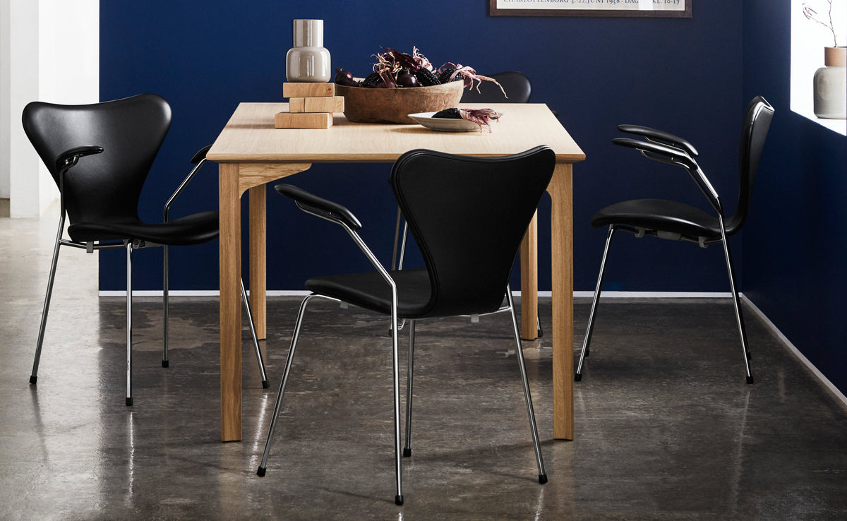 Series 7 Full Upholstery Armchair by Fritz Hansen, showing series 7 full upholstery armchairs in live shot.