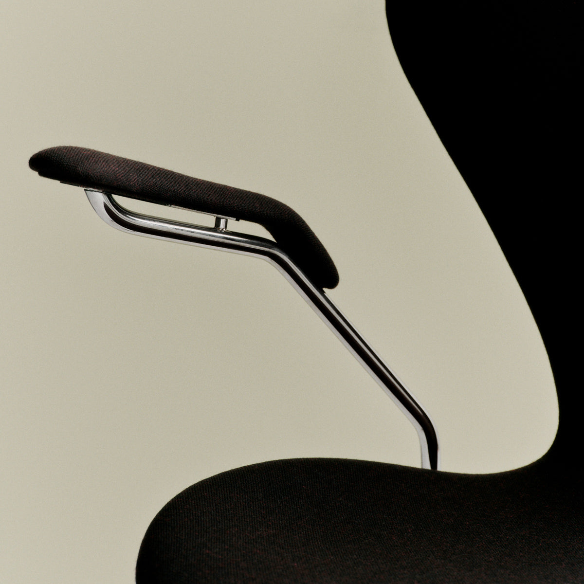 Series 7 Full Upholstery Armchair by Fritz Hansen, showing closeup view of series 7 full upholstery armchair in live shot.