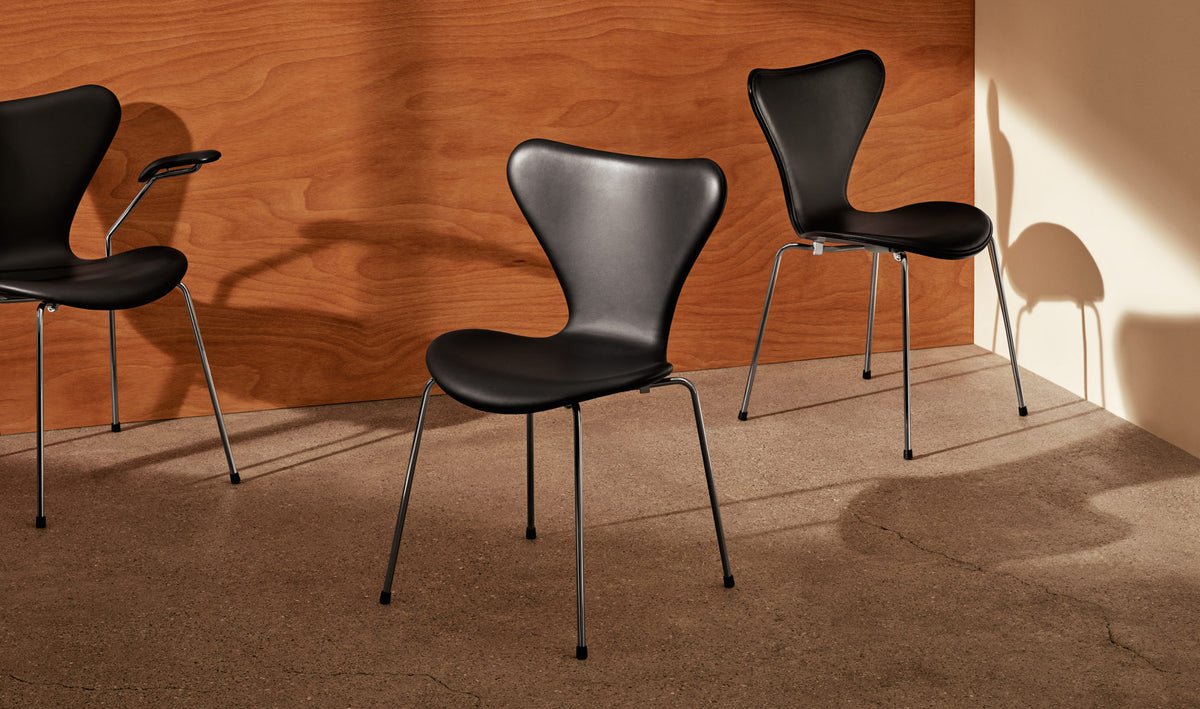 Series 7 Full Upholstery Chair by Fritz Hansen, showing series 7 full upholstery chairs in live shot.