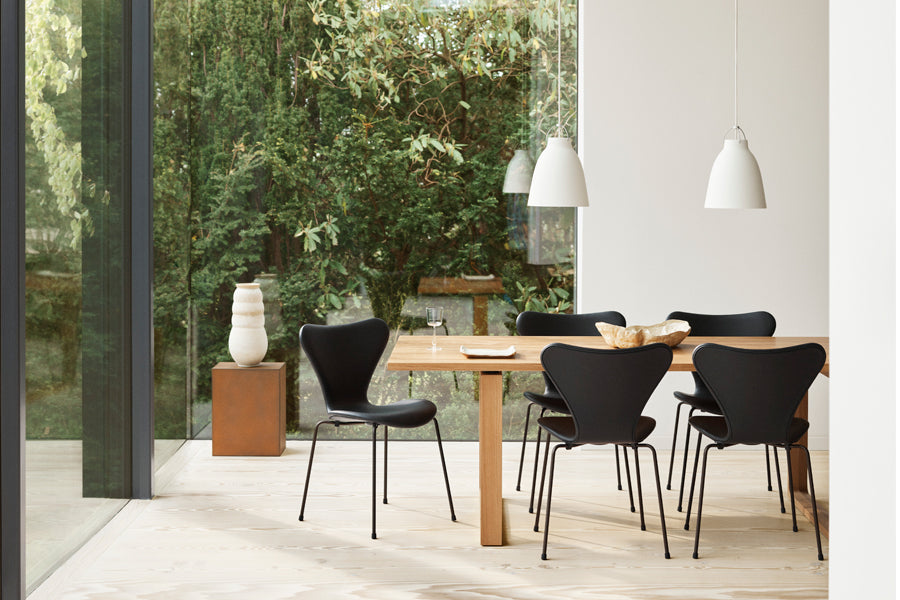 Series 7 Full Upholstery Chair by Fritz Hansen, showing series 7 full upholstery chairs in live shot.