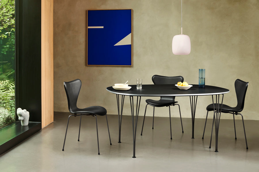 Series 7 Full Upholstery Chair by Fritz Hansen, showing series 7 full upholstery chairs in live shot.