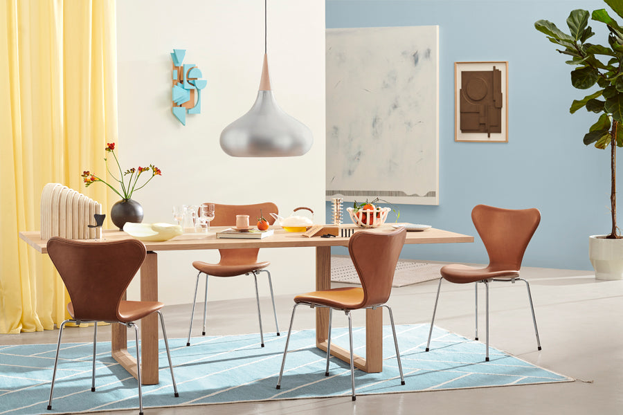 Series 7 Full Upholstery Chair by Fritz Hansen, showing series 7 full upholstery chairs in live shot.