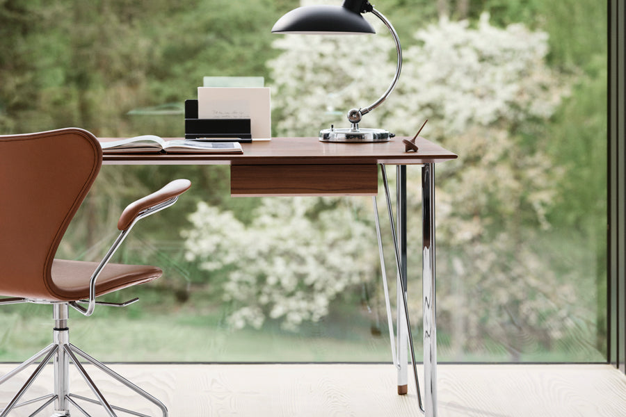 Series 7 Full Upholstery Swivel Armchair by Fritz Hansen, showing closeup view of series 7 full upholstery swivel armchair in live shot.