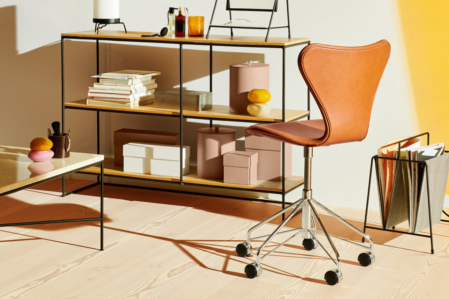 Series 7 Full Upholstery Swivel Chair by Fritz Hansen, showing series 7 full upholstery swivel chair in live shot.