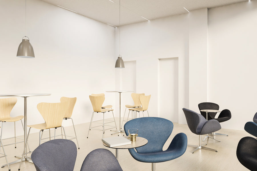 Series 7 Stool by Fritz Hansen, showing series 7 stools in live shot.