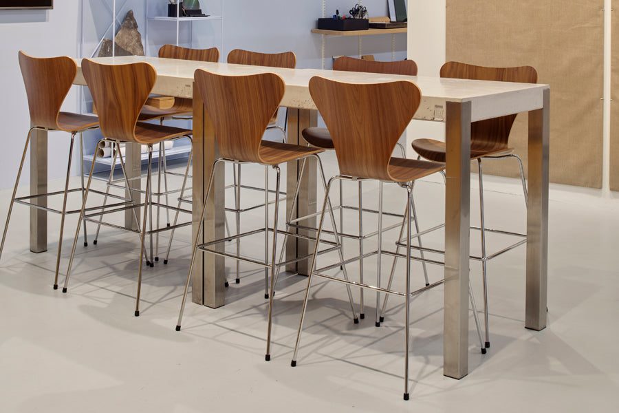 Series 7 Stool by Fritz Hansen, showing series 7 stools in live shot.