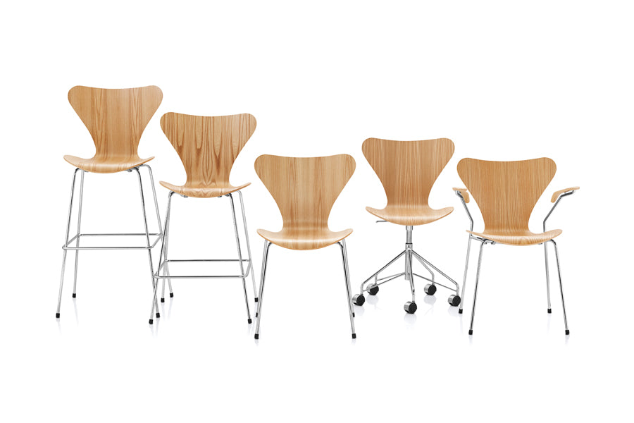 Series 7 Swivel Chair by Fritz Hansen, showing front view of series 7 swivel chair in natural veneer wood shell group/chrome powder coated steel.