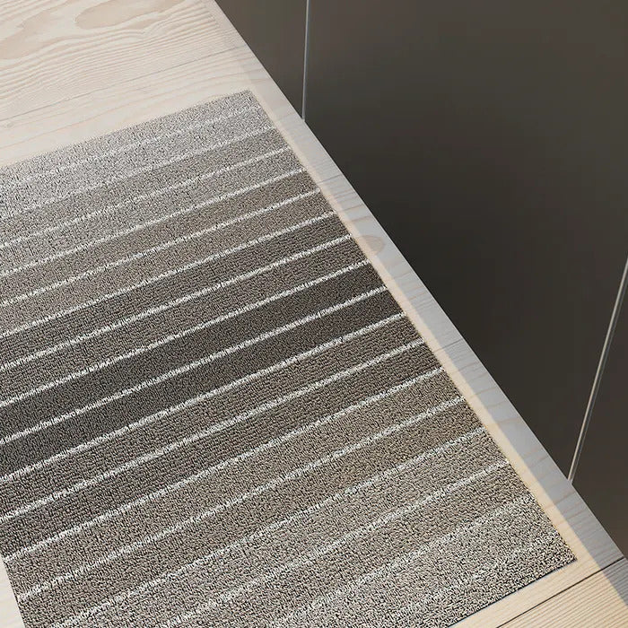 Shag Indoor/Outdoor Floormat by Chilewich, showing shag indoor/outdoor floormat in live shot.
