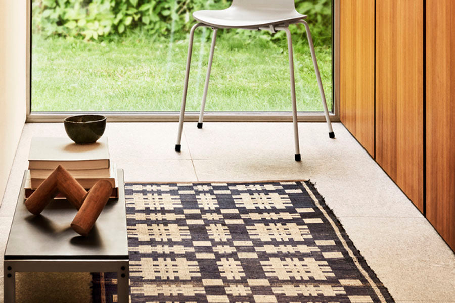 PK62 Side Table by Fritz Hansen, showing pk62 side table in live shot.