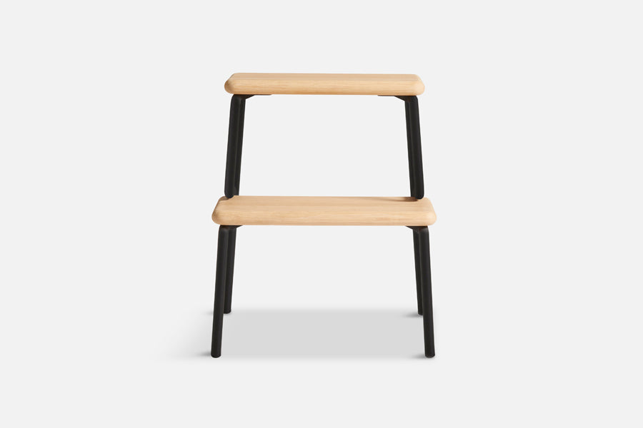 Slalom Step Stool by Woud, showing front view of slalom step stool in live shot.