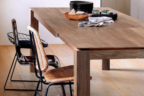 Slice Extendable Dining Table by Ethnicraft, showing slice extendable dining table in live shot.