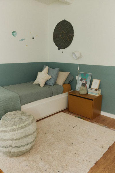 Solar System Pouf by Lorena Canals, showing solar system pouf in live shot.