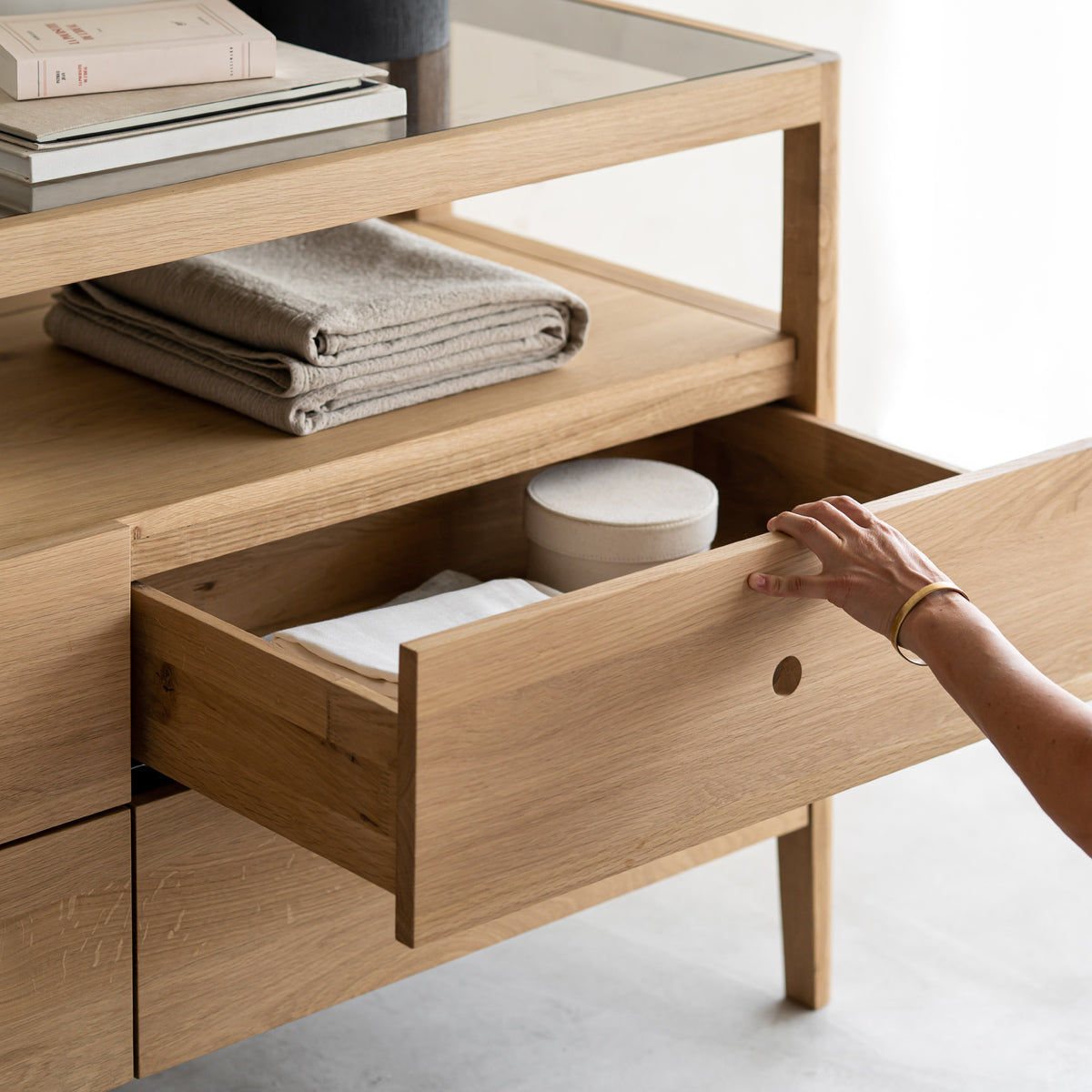 Spindle Dresser by Ethnicraft, showing closeup view of spindle dresser in live shot.