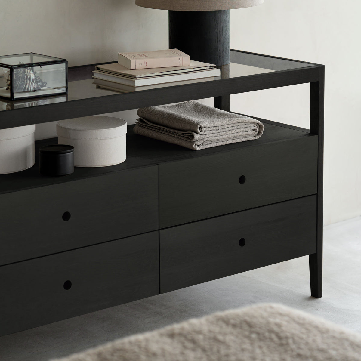 Spindle Dresser by Ethnicraft, showing closeup view of spindle dresser in live shot.
