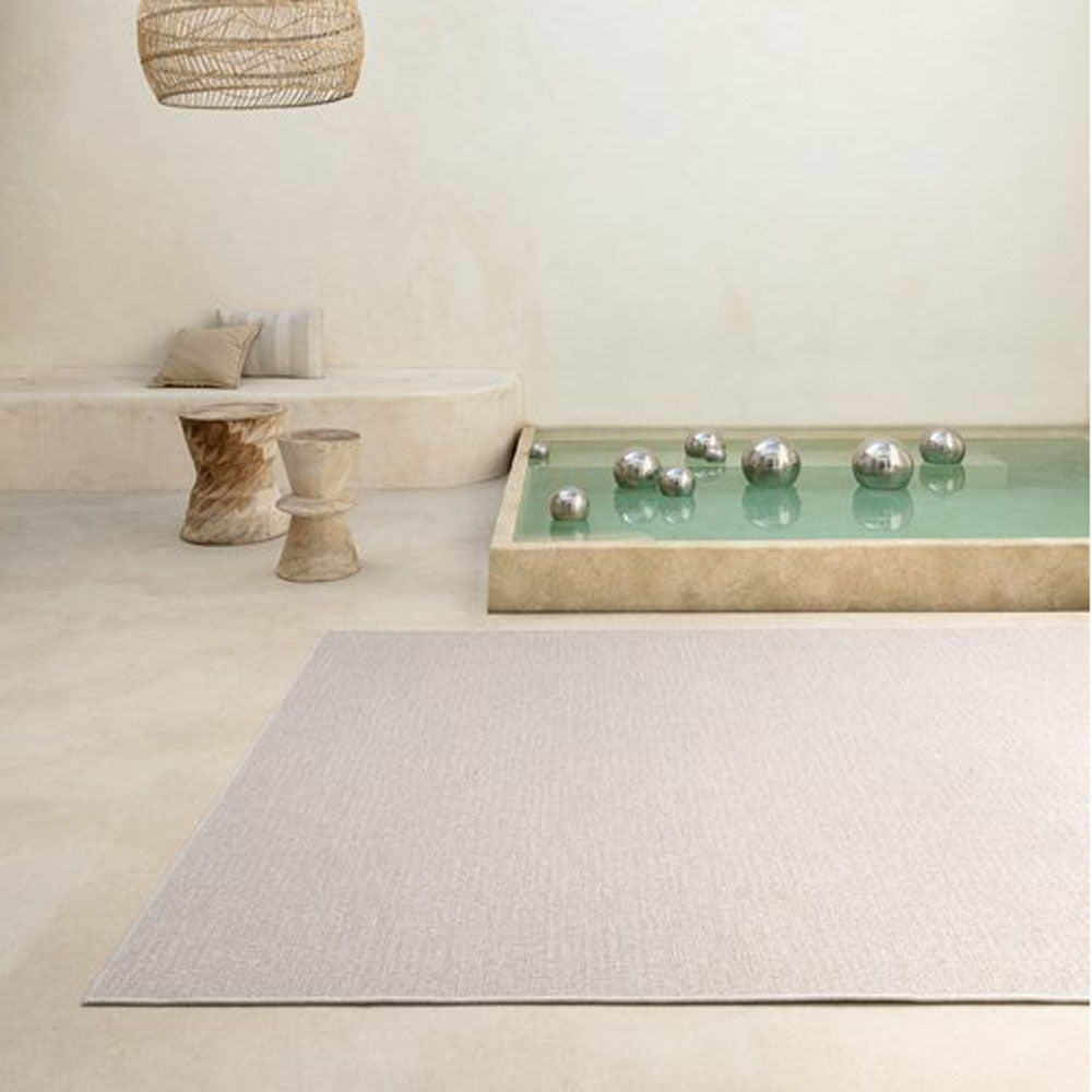 Rimini Woven Rug by Ligne Pure, showing rimini woven rug in live shot.
