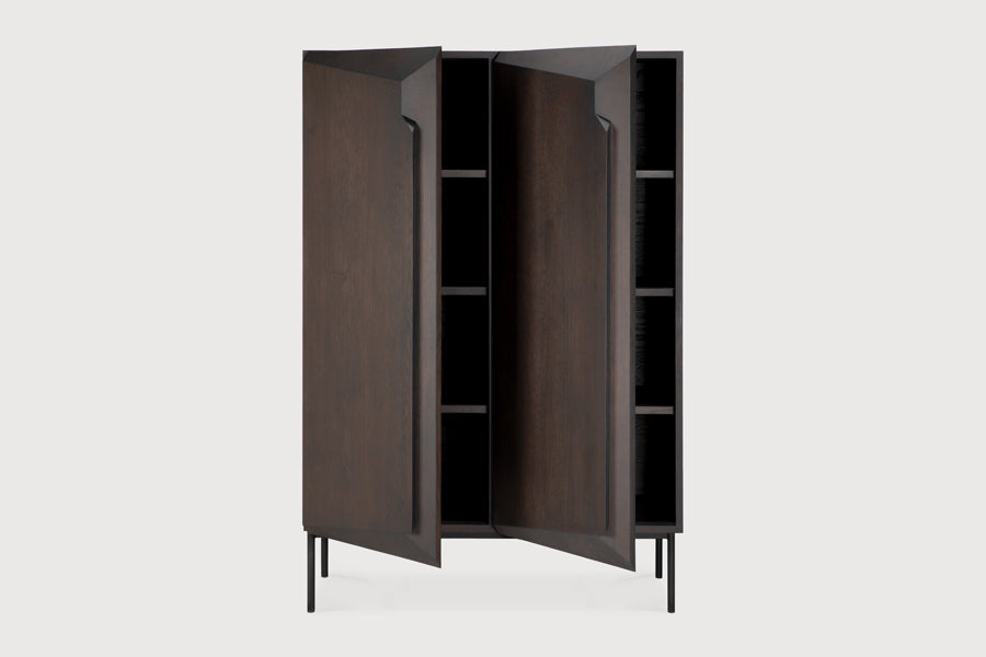Stairs Cupboard by Ethnicraft, showing closeup view of opened stairs cupboard in studio shot.