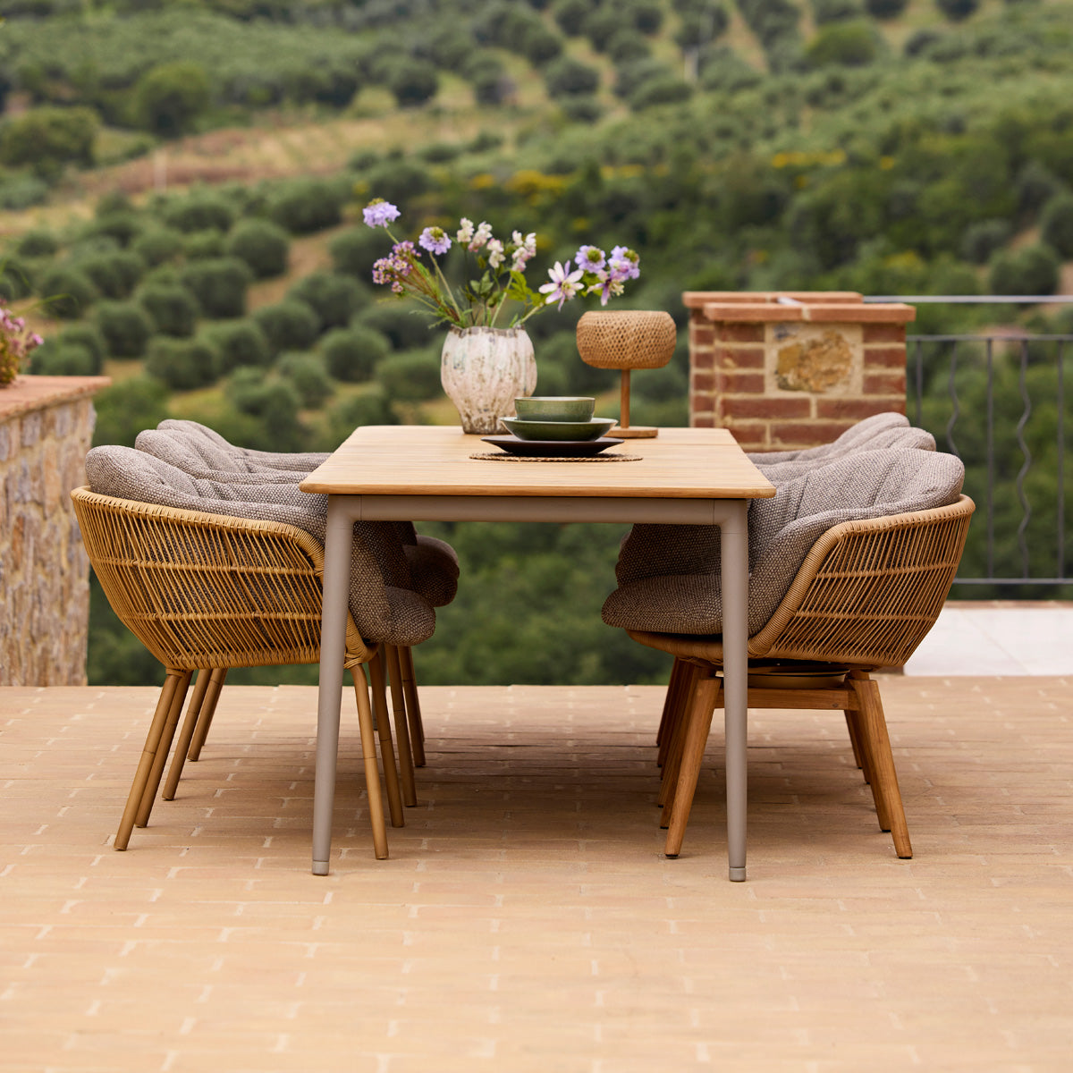 Stay Chair by Cane-Line, showing stay chairs in live shot.